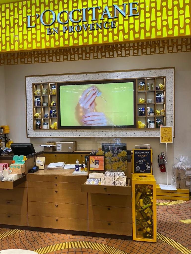 L'Occitane storefront window display with CrownTV digital signage